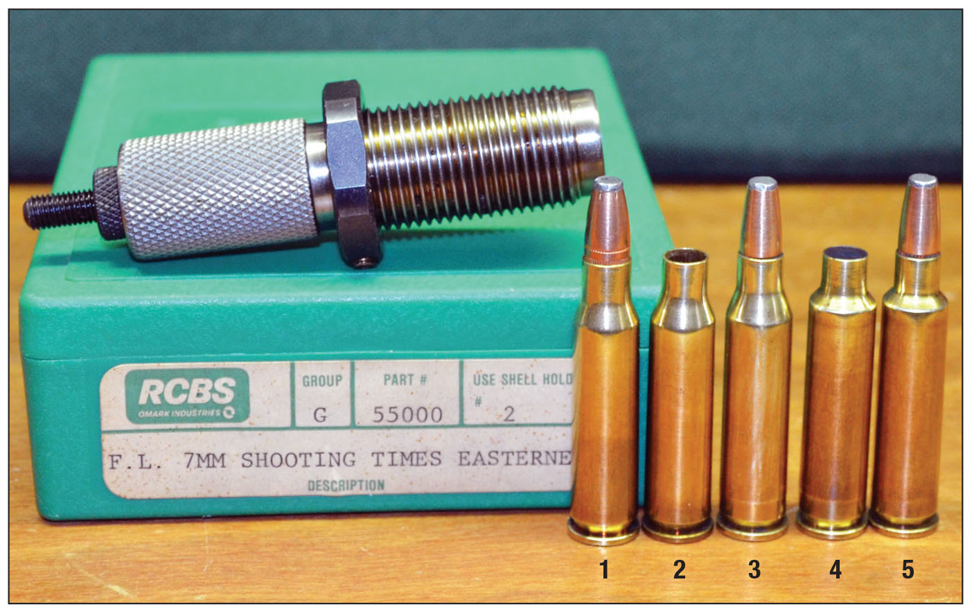 The 7mm STE case is easily formed by necking down the .307 Winchester case and fireforming: (1) .307 Winchester cartridge, (2) .307 Winchester case necked down, (3) case loaded for fireforming, (4) fireformed case and (5) loaded 7mm STE round.